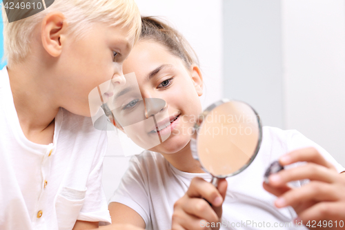 Image of Steatite, mineral. Geography at school. Smiling children admire a collection of minerals Small geologist. The collection of rocks and minerals