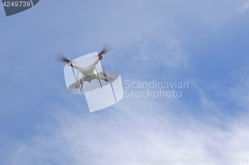 Image of DJI Phantom Quadrocopter in Action against Sky