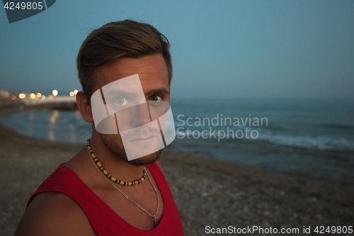 Image of man at the evening sea