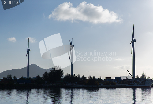 Image of turbines at wind farm on sea shore