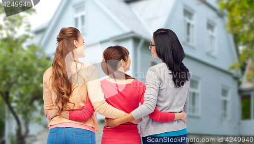 Image of international happy women from back hugging