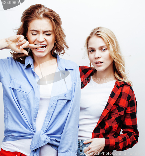 Image of best friends teenage girls together having fun, posing emotional on white background, besties happy smiling, lifestyle people concept close up