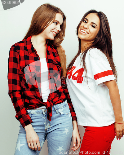 Image of best friends teenage girls together having fun, posing emotional on white background, besties happy smiling, lifestyle people concept, blond and brunette multi nations 