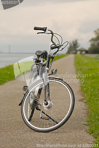 Image of Bicycle on the road along the river