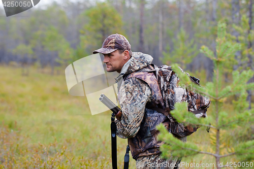 Image of hunter with gun