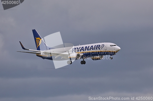 Image of Plane landing in cloudy weather