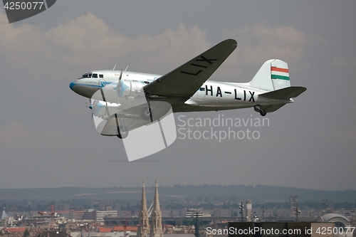 Image of Old aircraft over a city