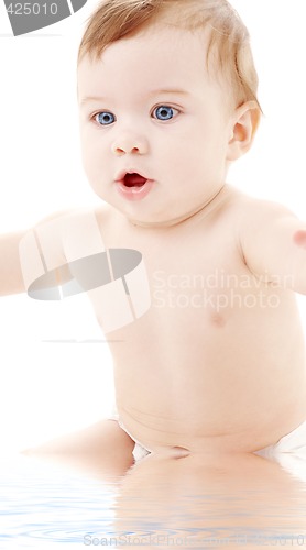 Image of portrait of sitting baby boy