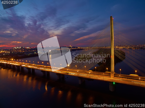 Image of Automobile and railroad bridge in Kiev, the capital of Ukraine. Bridge at sunset across the Dnieper River. Kiev bridge against the backdrop of a beautiful sunset in Kiev. Bridge in evening sunshine