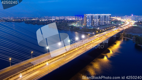 Image of Automobile and railroad bridge in Kiev, the capital of Ukraine. Bridge at sunset across the Dnieper River. Kiev bridge against the backdrop of a beautiful sunset in Kiev. Bridge in evening sunshine