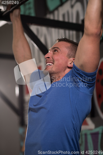 Image of man doing pull ups