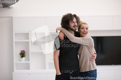 Image of couple hugging in their new home