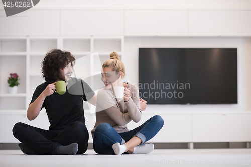 Image of young couple in their new home