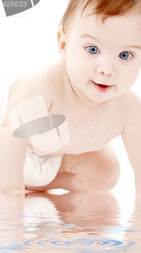 Image of portrait of crawling baby boy