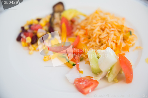 Image of vegetable salad and garnish on plate