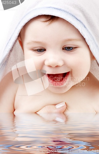 Image of happy baby with terry hoodie robe on head