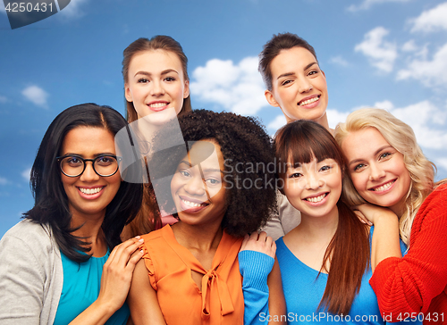 Image of international group of happy women hugging