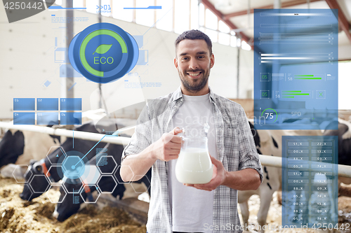 Image of man or farmer with cows milk on dairy farm