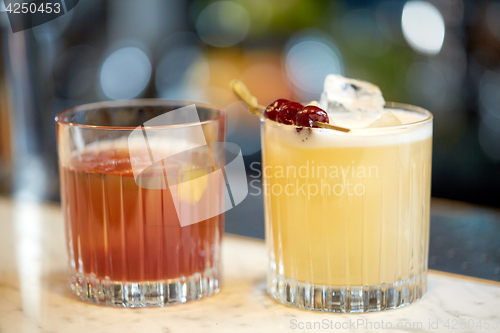 Image of glasses of cocktails at bar