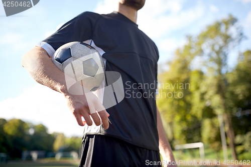 Image of close up of soccer player on football field