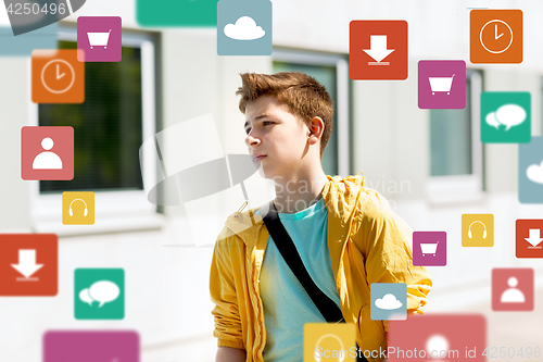 Image of teenage student boy walking outdoors