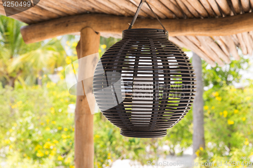 Image of lantern hanging under shed roof