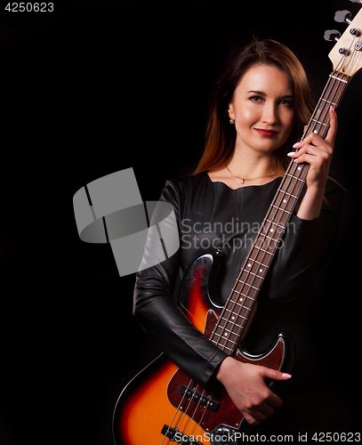 Image of Portrait of woman with guitar