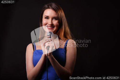 Image of Singing woman on empty background