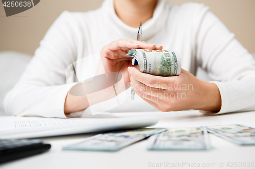 Image of Hands counting money, close up