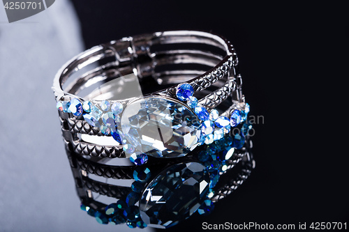 Image of Bracelet with blue stones over black