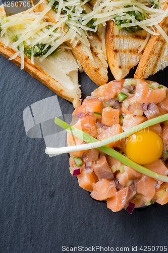 Image of fish tartare with quail egg 