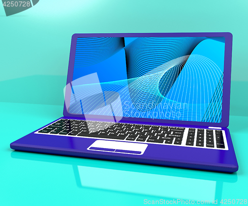 Image of Computer On Desk With Spiral Pattern