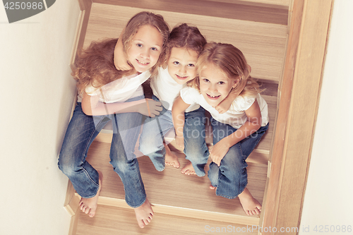 Image of Portrait of happy children which are sitting on the stairs in th