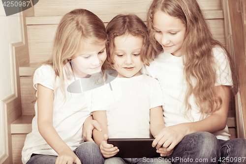 Image of Portrait of happy children which are sitting on the stairs in th