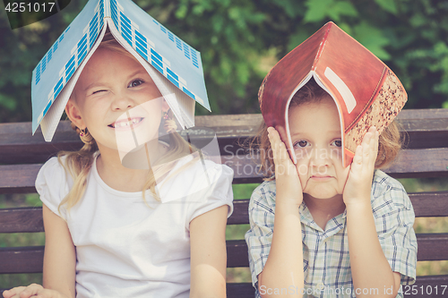 Image of Three happy children  playing in park