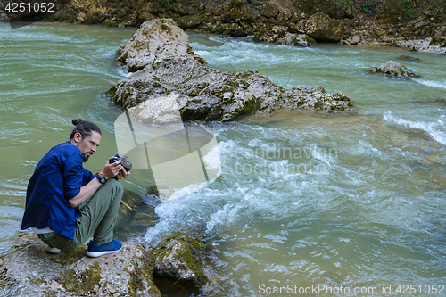 Image of Photographing a mountain river