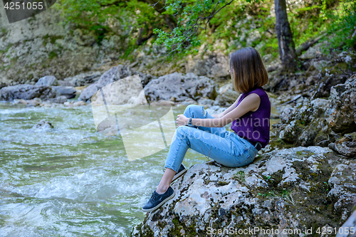 Image of The girl at the river