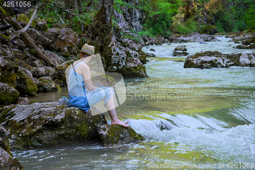 Image of The girl at the river