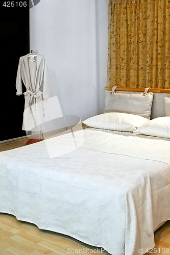 Image of Bathrobe and bed