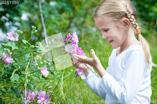 Image of portrait of a beautiful young girl with wildflowers