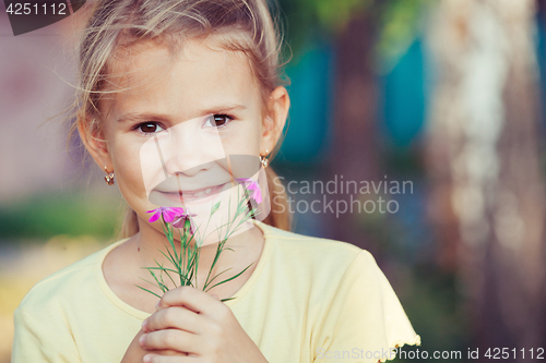 Image of portrait of a beautiful young girl with wildflowers