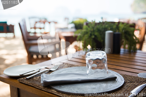 Image of served table at open-air restaurant on beach