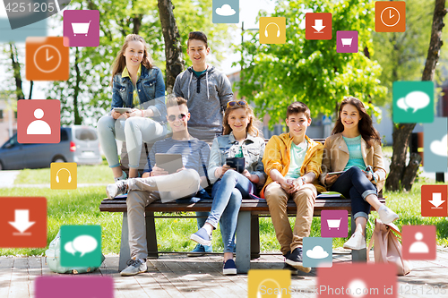 Image of group of teenage students with tablet pc outdoors