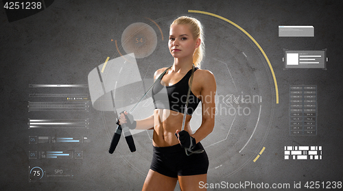 Image of young sporty woman with jumping rope