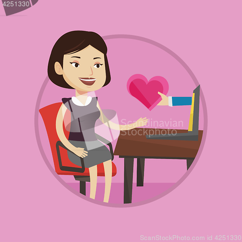 Image of Young woman dating online using laptop.