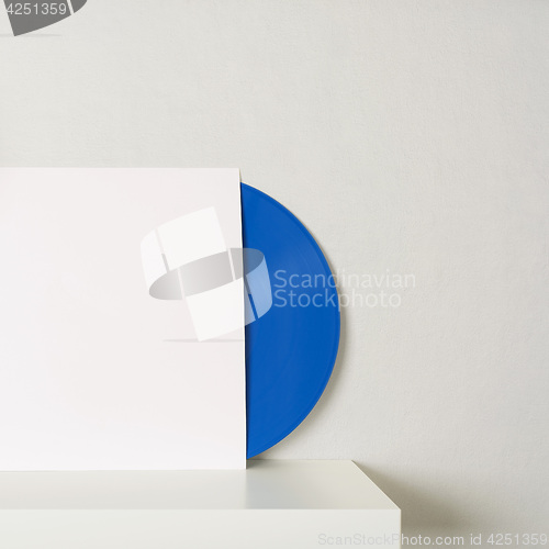 Image of blue vinyl record in white paper case