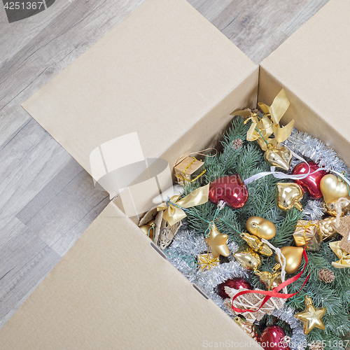 Image of christmas tree, glitter baubles and tinsel in the box