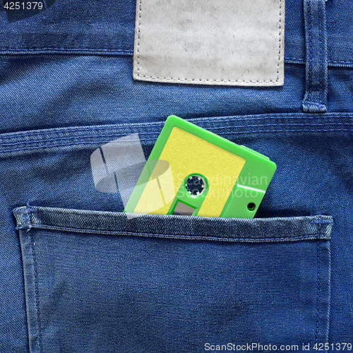 Image of Green cassette tape in a pocket
