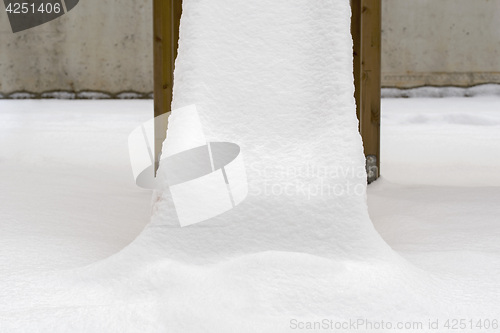 Image of Children\'s slide covered with snow