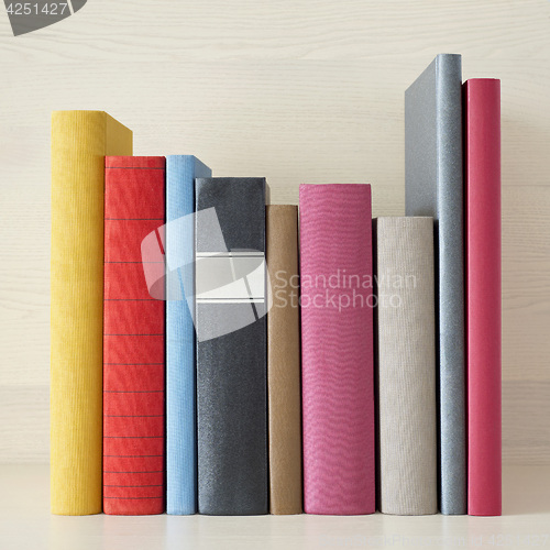 Image of stack of books in the bookself